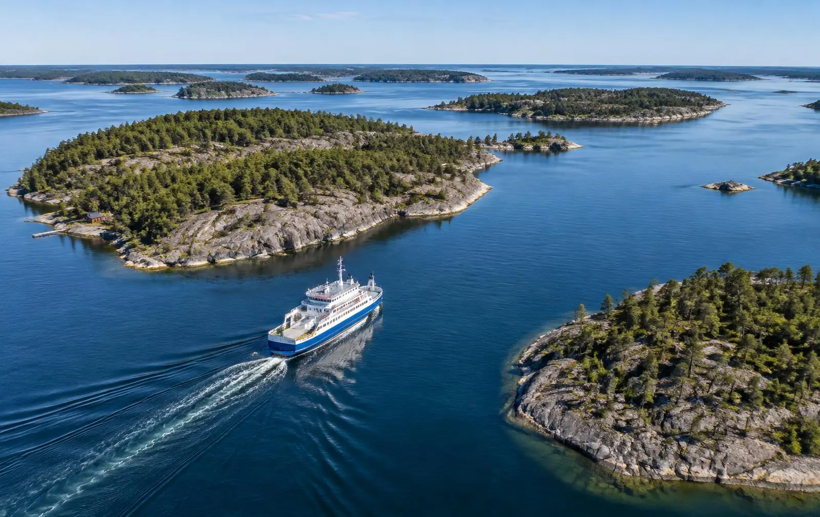 Ferry among archipelago islands